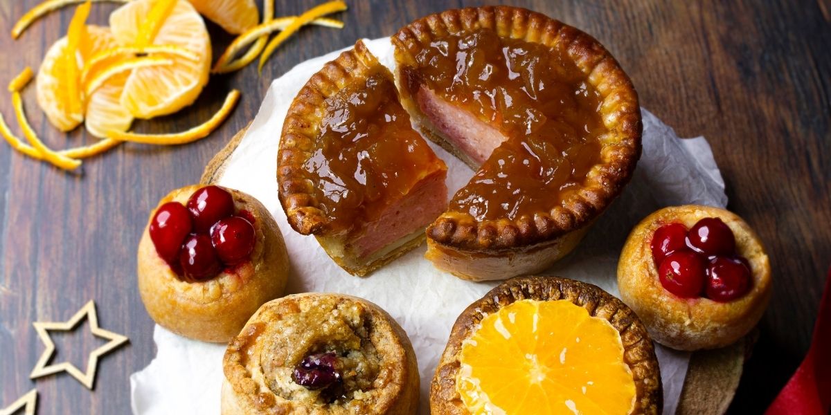 Champion Sweet & Savoury Topped Pork Pies - Mini Pork Pies topped with cranberry, orange, tyke stuffing mix and chutney