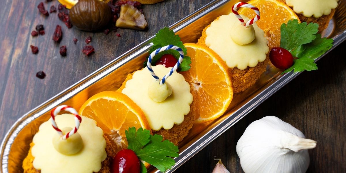 Pork & Cranberry Baubles - Santas Sausage Mix with a cranberry centre coated in special schnitzel mix, topped with pastry